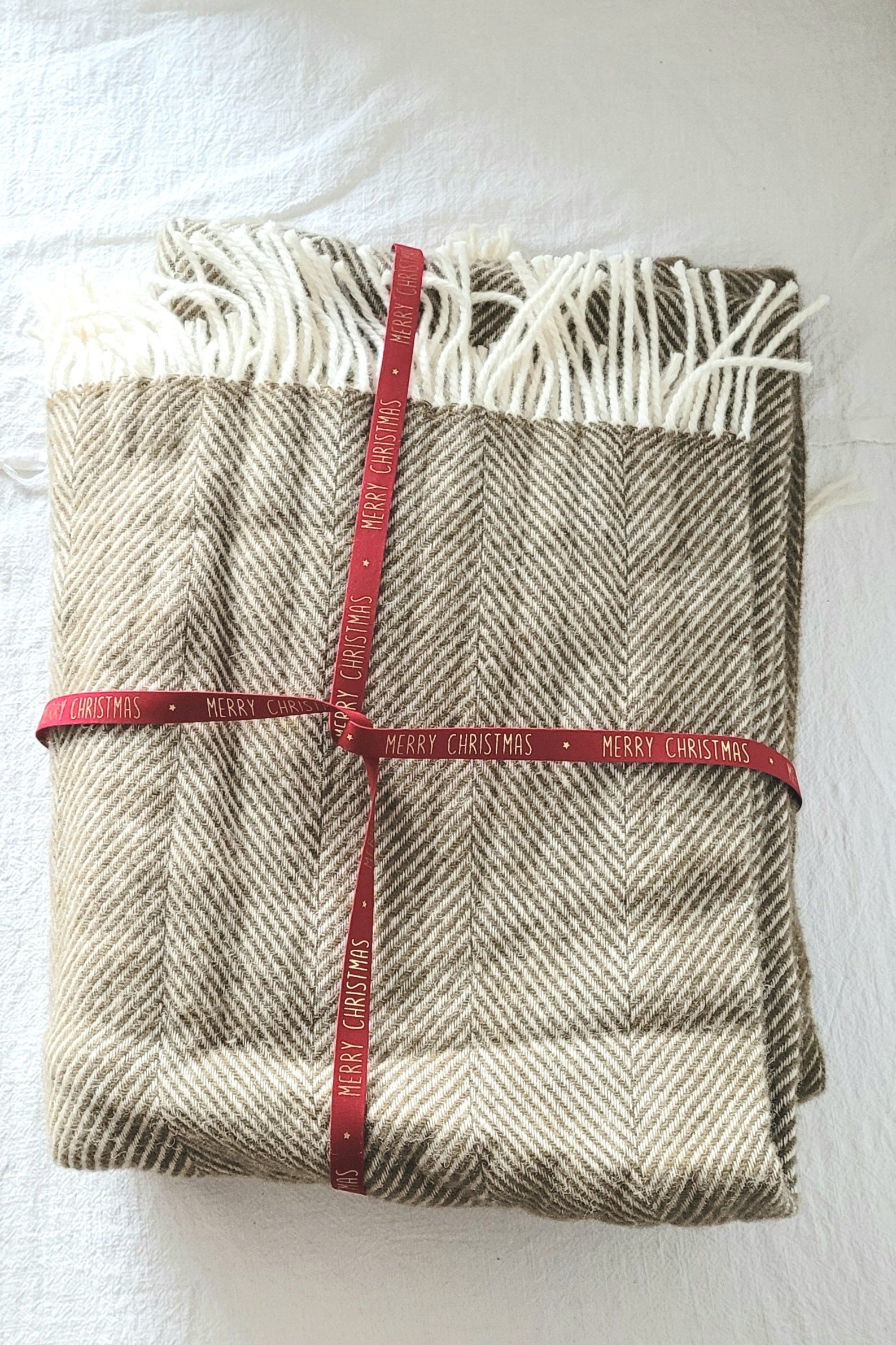 Wollen deken visgraat olijf